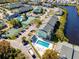 Aerial view of the community showcasing the pool, tennis courts, and convenient parking at 455 Alt 19 S # 162, Palm Harbor, FL 34683
