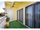Cozy balcony with artificial grass, sliding glass doors and views at 455 Alt 19 S # 162, Palm Harbor, FL 34683
