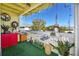 Well-decorated balcony with artificial turf, furniture and garden decorations at 455 Alt 19 S # 162, Palm Harbor, FL 34683