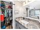 Bathroom with modern vanity, mirror, and view of the Primary bedroom and walk-in closet at 455 Alt 19 S # 162, Palm Harbor, FL 34683