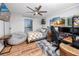 Spacious bedroom with a comfortable bed, wood-look floors, and unique décor at 455 Alt 19 S # 162, Palm Harbor, FL 34683