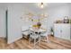 Bright dining area features a white table with a banquette, open to kitchen, and decorated with modern accents at 455 Alt 19 S # 162, Palm Harbor, FL 34683