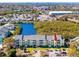 Condo exterior with balcony overlooking parking and tropical landscaping in a waterfront community at 455 Alt 19 S # 162, Palm Harbor, FL 34683