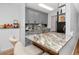 Kitchen with gray cabinets, stainless appliances, breakfast bar, and stunning granite countertops for modern appeal at 455 Alt 19 S # 162, Palm Harbor, FL 34683