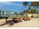 Community picnic area featuring grills and picnic tables, perfect for outdoor gatherings and enjoying the sunshine at 455 Alt 19 S # 162, Palm Harbor, FL 34683