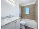 Nicely renovated bathroom with tiled shower and modern vanity at 4716 Town N Country Blvd, Tampa, FL 33615
