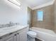 Updated bathroom featuring a tiled shower, a new vanity and countertop at 4716 Town N Country Blvd, Tampa, FL 33615