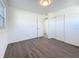 Bright bedroom with sleek, wood-look flooring and a neutral color palette at 4716 Town N Country Blvd, Tampa, FL 33615