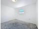 Vacant bedroom with a single window offers a clean, blank slate for personalization at 4716 Town N Country Blvd, Tampa, FL 33615
