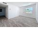 Comfortable bedroom with natural lighting and new wood-look flooring at 4716 Town N Country Blvd, Tampa, FL 33615