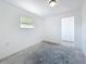Vacant bedroom with a single window offers a blank slate for customization and personal style at 4716 Town N Country Blvd, Tampa, FL 33615