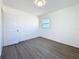 Cozy bedroom featuring modern gray flooring and a window at 4716 Town N Country Blvd, Tampa, FL 33615