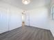 Bedroom featuring gray flooring, white walls, closet and a window at 4716 Town N Country Blvd, Tampa, FL 33615