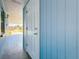 Exterior shot of home's blue siding and covered entryway at 4716 Town N Country Blvd, Tampa, FL 33615