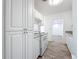 Cozy kitchen with new white cabinets, new stainless appliances, and granite countertops at 4716 Town N Country Blvd, Tampa, FL 33615