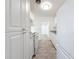 Well-lit kitchen area features new white cabinets, stainless steel appliances, and new flooring at 4716 Town N Country Blvd, Tampa, FL 33615