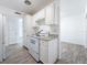 Efficient kitchen with white cabinetry, granite countertops, and new appliances at 4716 Town N Country Blvd, Tampa, FL 33615