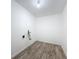 Functional laundry room with modern flooring, ready for appliances and easy access at 4716 Town N Country Blvd, Tampa, FL 33615