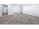Bright, spacious living area with an open-concept feel and modern gray flooring at 4716 Town N Country Blvd, Tampa, FL 33615