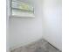 Bright room featuring a window that floods the space with natural light, a minimalist aesthetic at 4716 Town N Country Blvd, Tampa, FL 33615
