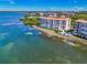 Breathtaking waterfront condo with a private dock, pool, lush landscaping, and stunning views of the bay at 4801 Osprey S Dr # 404, St Petersburg, FL 33711