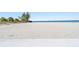 Beach with white sand and clear blue water at 4801 Osprey S Dr # 404, St Petersburg, FL 33711