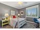 Comfortable bedroom with a cozy gray color, and natural lighting at 4801 Osprey S Dr # 404, St Petersburg, FL 33711