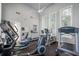 Well-equipped fitness center with multiple machines and natural light, promoting a healthy and active lifestyle at 4801 Osprey S Dr # 404, St Petersburg, FL 33711