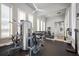 Well-equipped fitness center with weight machines, free weights, and mirrored wall, promoting a healthy lifestyle at 4801 Osprey S Dr # 404, St Petersburg, FL 33711