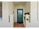 Inviting front door with decorative accents and a well-maintained tiled entryway at 4801 Osprey S Dr # 404, St Petersburg, FL 33711