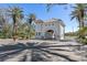 Elegant gated entrance with a charming gatehouse, lush landscaping, and a secure entry point for the community at 4801 Osprey S Dr # 404, St Petersburg, FL 33711