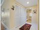 Hallway with closet doors leads to bathroom with glass shower door at 4801 Osprey S Dr # 404, St Petersburg, FL 33711