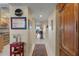 Bright hallway featuring tile floors, leading to a living area with water views and an adjacent kitchen at 4801 Osprey S Dr # 404, St Petersburg, FL 33711