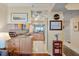 Open kitchen featuring light wood cabinets, granite countertops, and seamless flow to dining area at 4801 Osprey S Dr # 404, St Petersburg, FL 33711