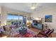 A spacious living room with hard wood floors, modern décor and beautiful water views at 4801 Osprey S Dr # 404, St Petersburg, FL 33711