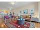 Bright living room with hardwood floors, stylish rug, and an abundance of natural light at 4801 Osprey S Dr # 404, St Petersburg, FL 33711