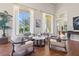 Bright and airy living room with modern seating, hardwood floors, and large windows at 4801 Osprey S Dr # 404, St Petersburg, FL 33711