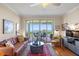A spacious living room with hard wood floors, modern décor and beautiful water views at 4801 Osprey S Dr # 404, St Petersburg, FL 33711