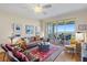 A spacious living room with hard wood floors, modern décor and beautiful water views at 4801 Osprey S Dr # 404, St Petersburg, FL 33711