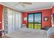 Bright main bedroom with calming water views and neutral colored quilt at 4801 Osprey S Dr # 404, St Petersburg, FL 33711