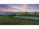 Beautiful water view of bay and mangroves at sunset, offering a serene and natural backdrop at 4801 Osprey S Dr # 404, St Petersburg, FL 33711