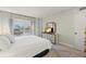 Bright bedroom featuring light walls, a light-colored bed, and a window view at 4900 Brittany S Dr # 205, St Petersburg, FL 33715