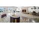 Inviting community room with cozy fireplace, comfortable seating, and stylish decor for social gatherings and relaxation at 4900 Brittany S Dr # 205, St Petersburg, FL 33715