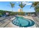 Community spa offering a relaxing retreat with clear water and lounge chairs, surrounded by a fence at 4900 Brittany S Dr # 205, St Petersburg, FL 33715