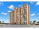 A beautiful condo building featuring lots of large balconies on a bright, sunny day at 4900 Brittany S Dr # 205, St Petersburg, FL 33715