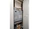 Close-up of HVAC System showcasing the unit's specifications and maintenance, placed inside a closet at 4900 Brittany S Dr # 205, St Petersburg, FL 33715