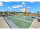 Community shuffleboard court with a view of the high-rise condo building at 4900 Brittany S Dr # 205, St Petersburg, FL 33715