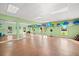 Spacious yoga studio with wooden floors, large mirrors, and decorative balloons at 4900 Brittany S Dr # 205, St Petersburg, FL 33715