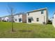 A well-maintained backyard with lush green grass and a cozy patio, perfect for outdoor enjoyment at 5764 Hollingworth Trl, Wesley Chapel, FL 33545