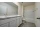 A bright bathroom with double sinks, shower and tub combo at 5764 Hollingworth Trl, Wesley Chapel, FL 33545